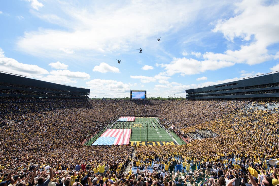 Michigan Stadium — the Big House — packed with 107,601 fans in maize and blue, one continuous bowl with no upper-deck overhangs