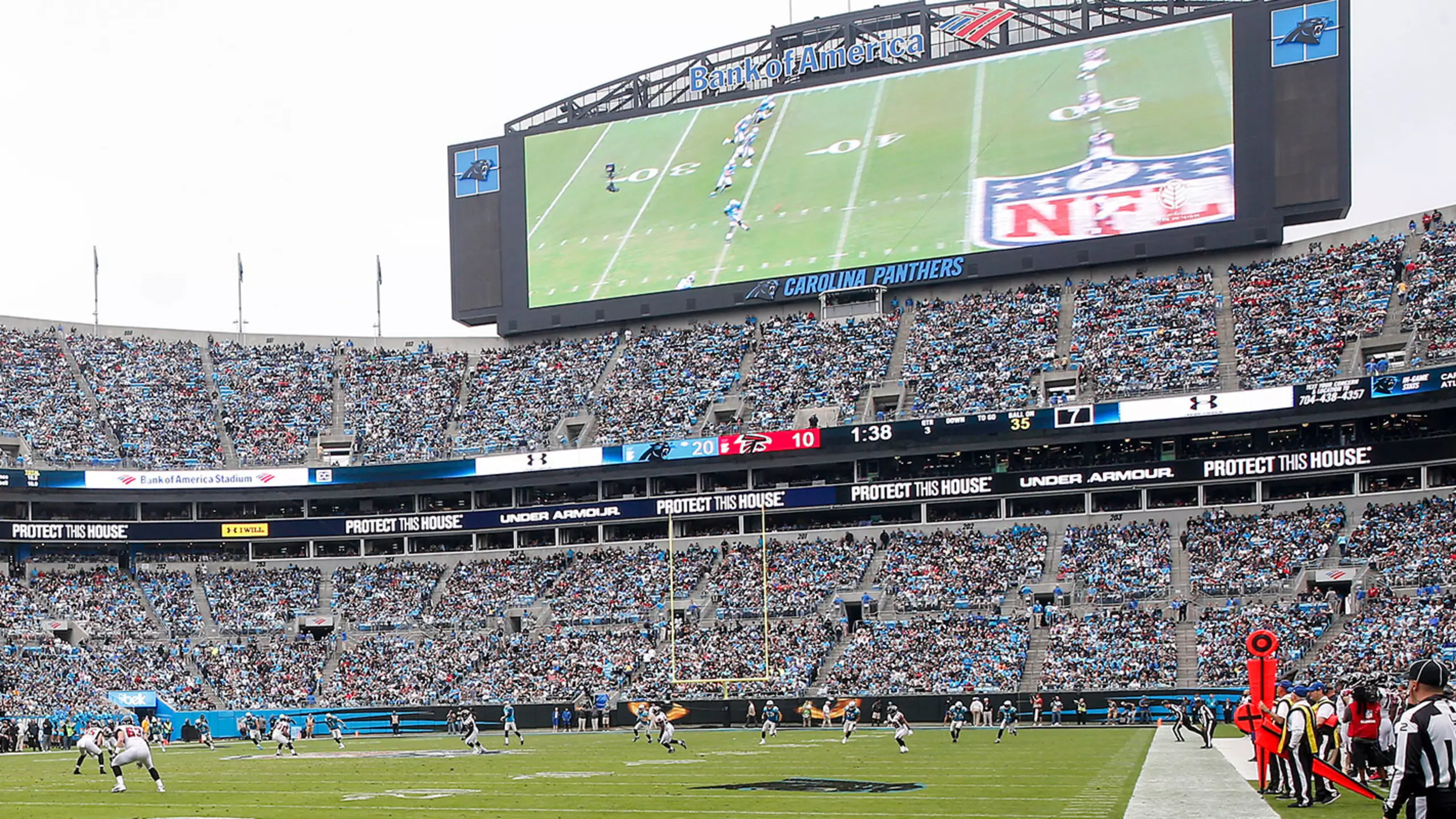 General view of Bank of America Stadium filled with Carolina Panthers fans on game day, the Charlotte Uptown skyline behind the upper deck