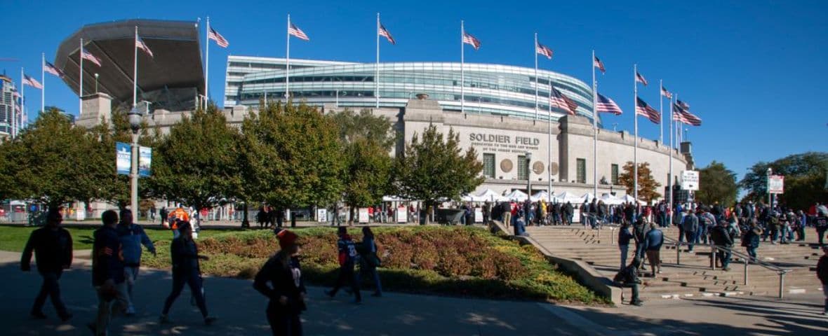 A general view of Soldier Field's historic colonnades packed with Chicago Bears fans on game day, Lake Michigan behind the stadium