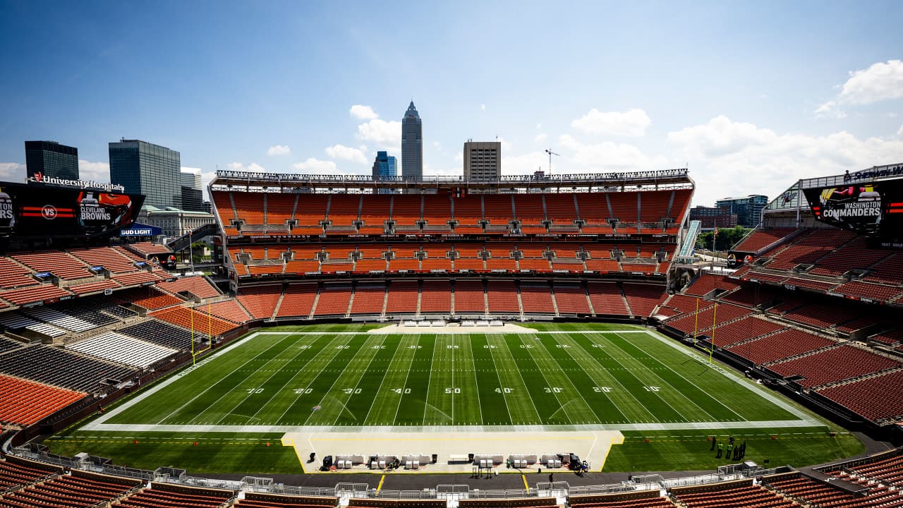 General view of Huntington Bank Field packed with Cleveland Browns fans on game day, the downtown Cleveland skyline visible beyond the stands