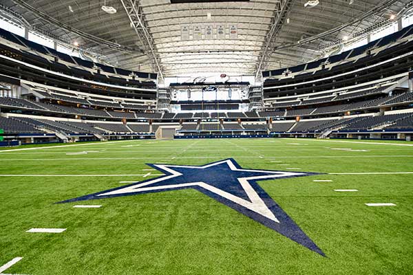 A general view of AT&T Stadium filled with Dallas Cowboys fans on game day, the blue star visible at midfield