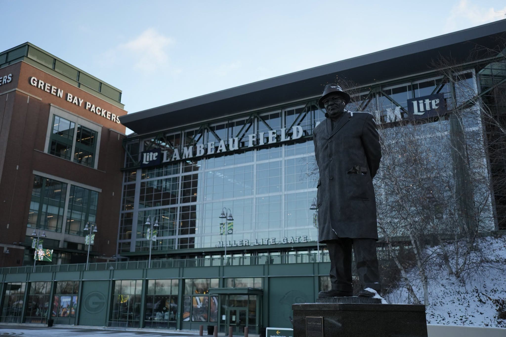 A general view of Lambeau Field filled with Green Bay Packers fans on game day, green and gold throughout the bowl and the frozen tundra field below