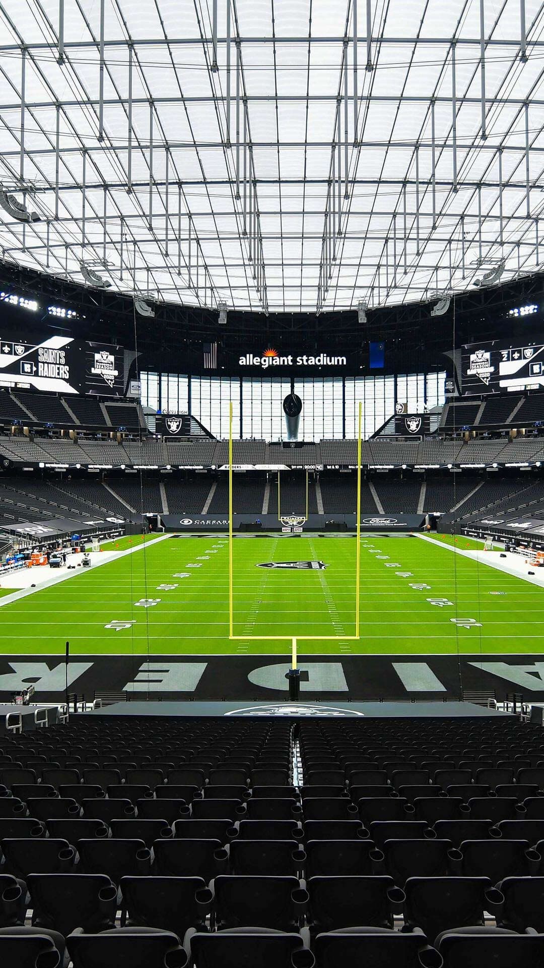 General view of Allegiant Stadium filled with Las Vegas Raiders fans on game day, the black dome roof overhead