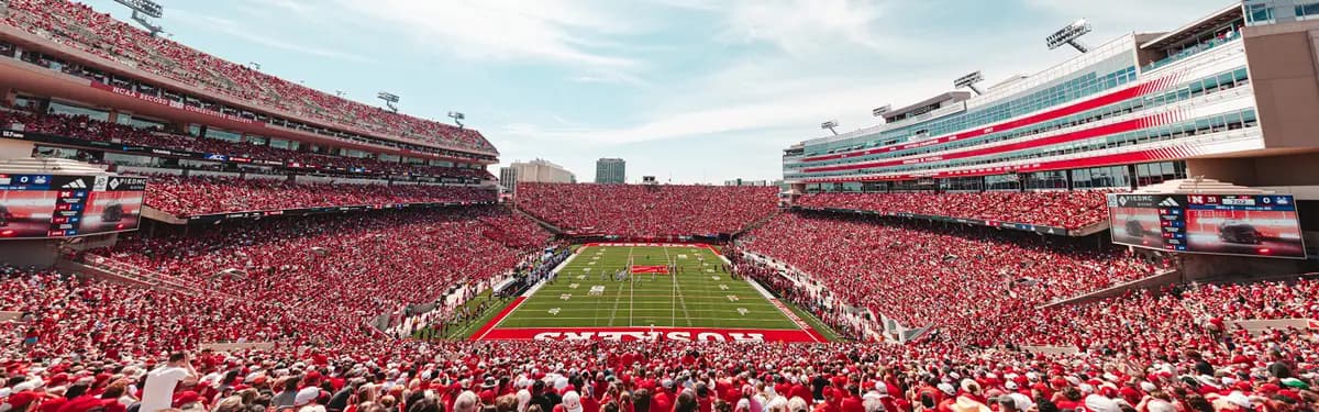 Memorial Stadium on a Nebraska Saturday — the Sea of Red filling every seat from end zone to end zone