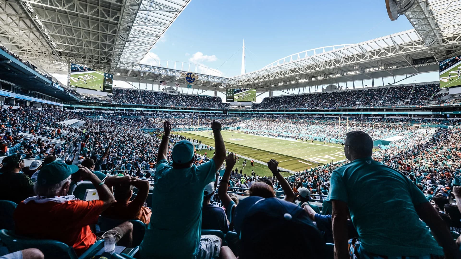A general view of Hard Rock Stadium filled with Miami Dolphins fans in aqua and orange on game day